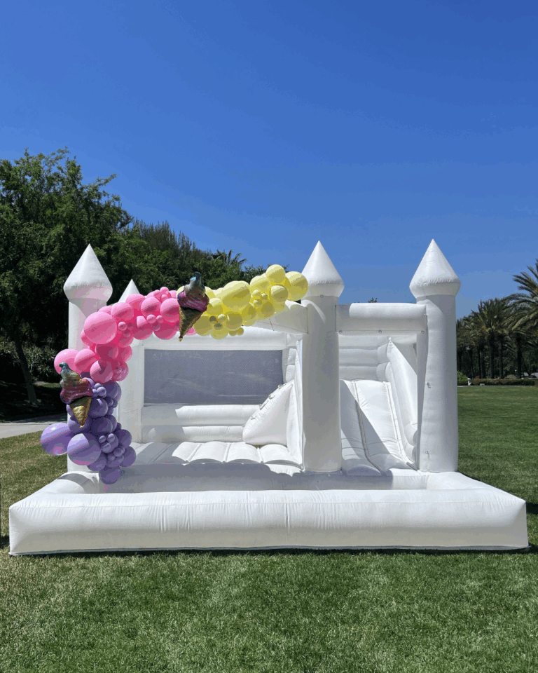 Bounce house rental set up in Riverside CA backyard for kids birthday party